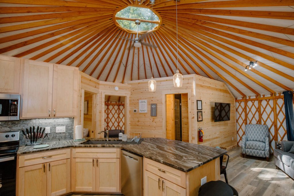 Kitchen and living room space inside of a Dupont Yurt.