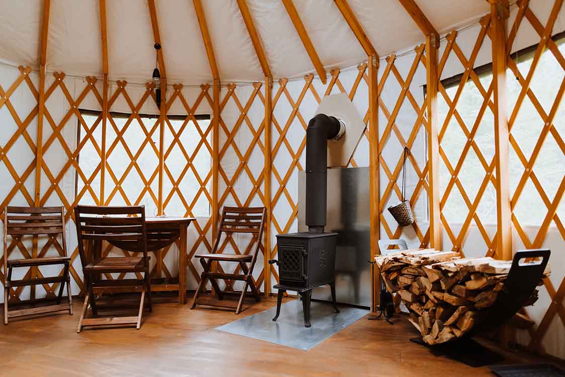 Built-in wood furnace inside a Pacific Yurt at Radius Retreat.