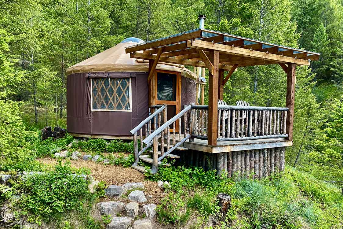 Radius Retreat yurt in a green forest.