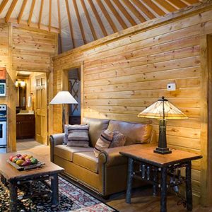 Leather couch inside the living room of a modern Pacific Yurt.