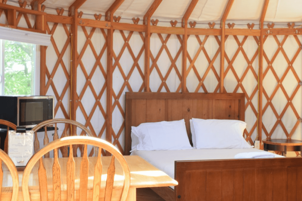 interior of yurt with large bed and frame