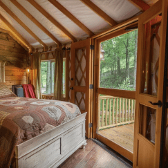 interior of yurt with wood features and bed frame