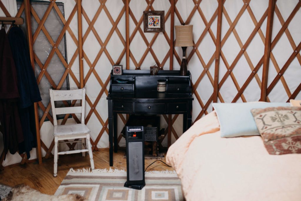 cozy yurt with bedroom and space heater