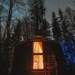 yurt at night in forest