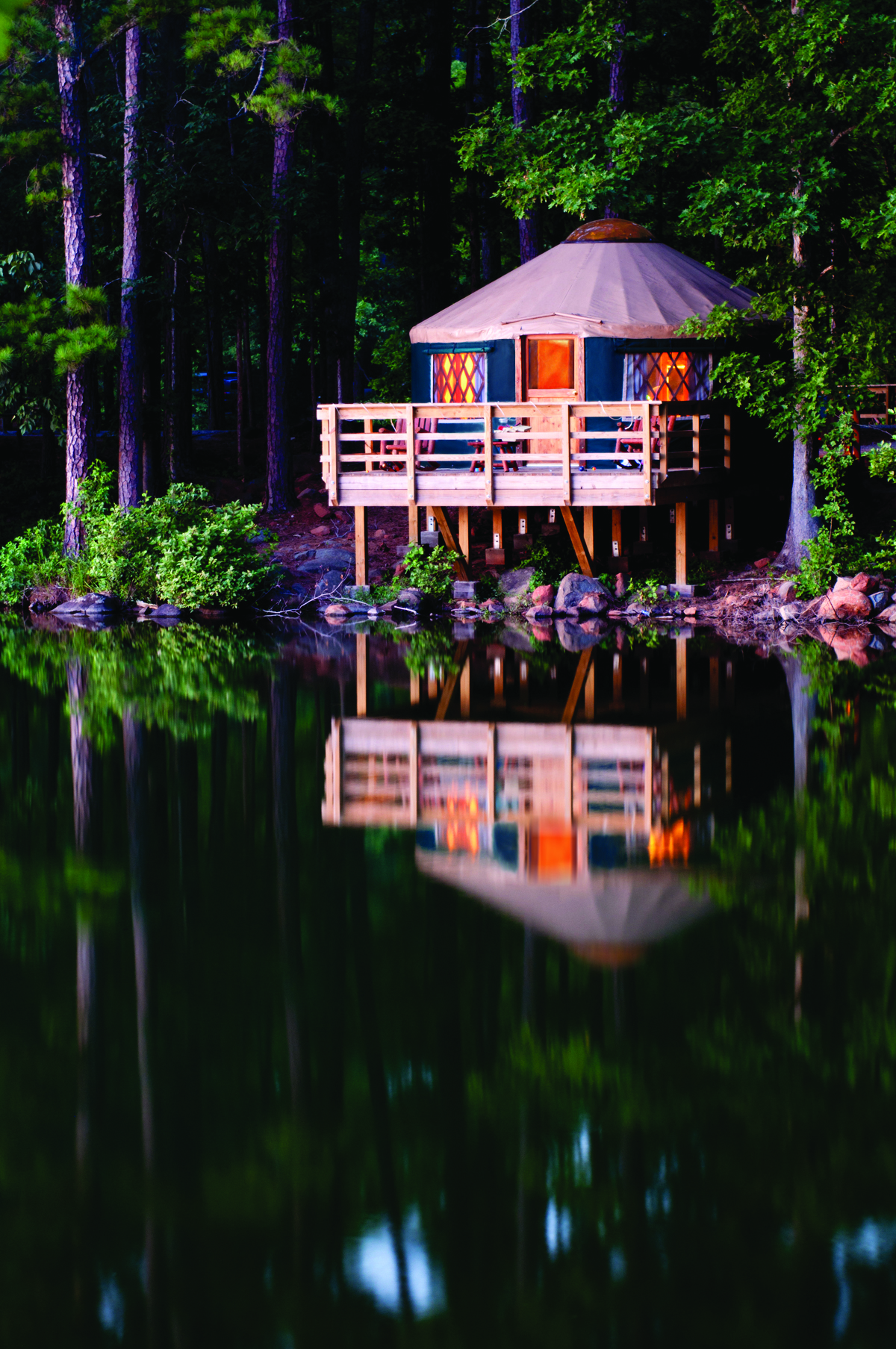 Pacific Yurt reflected in lake at dusk